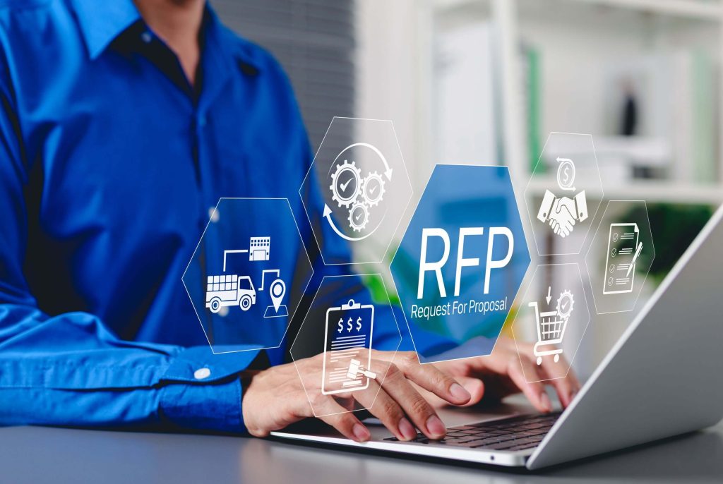 Professional reviewing an RFP on a laptop